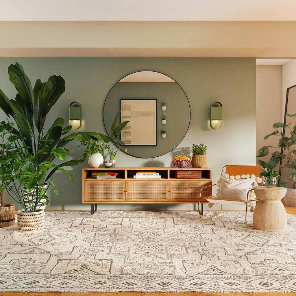 Stylish living room with plants, a round mirror, a wicker console table, and a patterned rug for modern decor inspiration